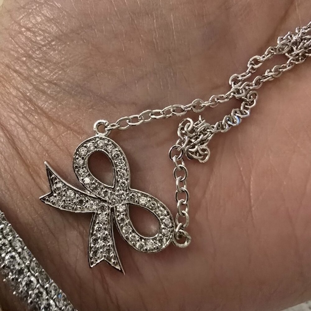Solid sterling silver. 925 pave bow ribbon necklace